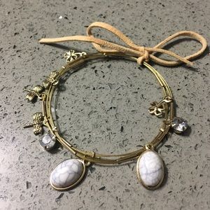 Set of gold bracelets with cute charms